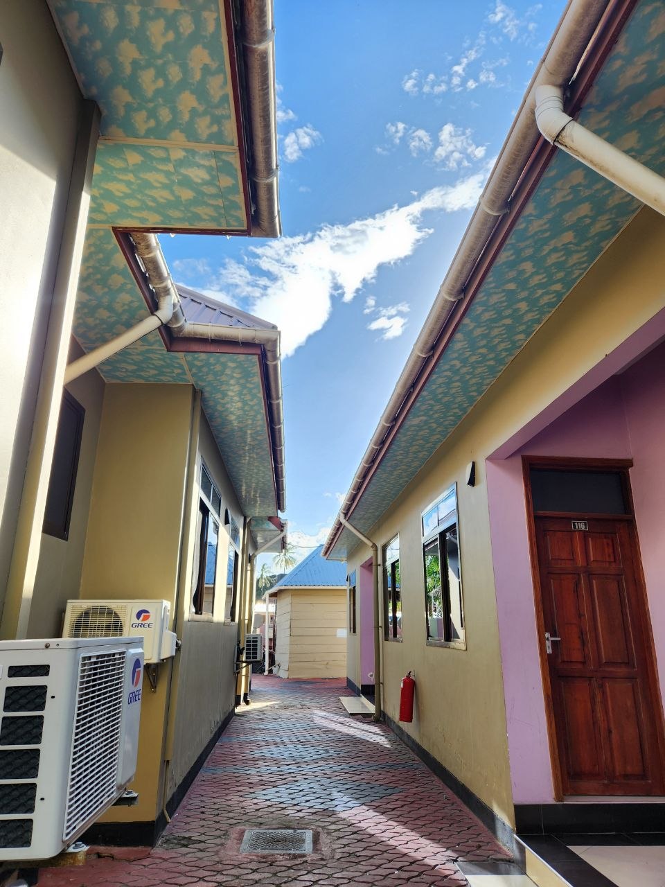 Sunny courtyard between lodge wings
